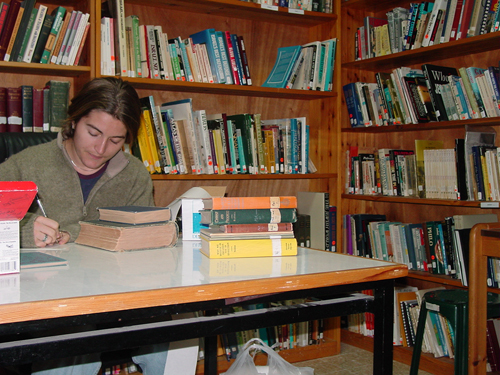 student studying in library